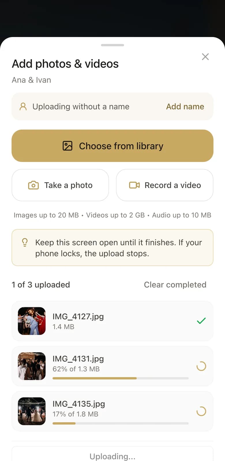 The upload sheet on a guest's phone, three photos going up